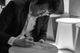 Black and white portrait of Oki Sato, founder of Nendo, sketching one of his famous minimalist design drawings.